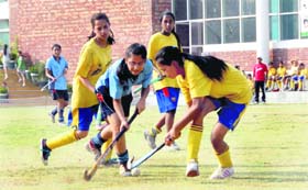 A match in progress during the DDCSA inter-school girls hockey tournament at Unison World School in Dehradun on Wednesday
