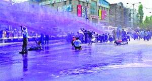 Government employees being sprayed with dyed water after they tried to gherao the civil secretariat in Srinagar on Wednesday.