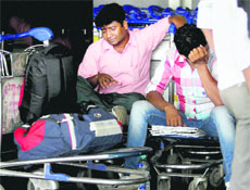 Stranded passengers at the Mumbai International Airport in Mumbai on Wednesday. 