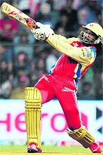 Royal Challengers Bangalores Chris Gayle plays a shot during their match against Mumbai Indians at The Wankhede Stadium in Mumbai on Wednesday. Royal Challengers Bangalore won by nine wickets
