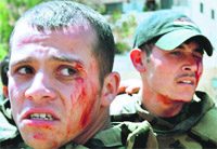 Wounded Syrian soldiers after a roadside bomb attack targeted their convoy in Daraa.