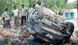 A car after it hit a tree on the airport road in Amritsar on Thursday.