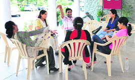 Contractual teachers sit in the corridor of PGGCG, Sector-11, Chandigarh, on Thursday.