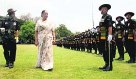 Outgoing Uttarakhand Governor Margaret Alva takes the salute from an Army contingent at Raj Bhavan before her departure from Dehradun on Thursday