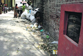 A foundation stone mentions relaying of the road with inter-locking tiles in Jalandhar.