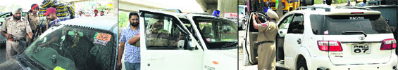 Traffic police personnel challan and remove black films from vehicles owned by 'VIPs' in Jalandhar on Thursday.