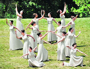 Actresses perform a Greek ancient dance. 