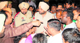 Residents argue with police personnel while protesting against the death of a child during unloading of wooden logs from a truck in Amritsar on Friday.
