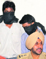 The two accused in police custody in Mohali on Friday.