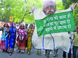Members of different groups take out a rally under the banner of Pension Parishad, demanding a universal pension scheme at Jantar Mantar in New Delhi on Friday. 