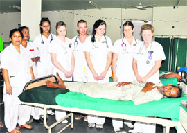 Canadian nursing interns with a patient at Doon Hospital in Dehradun on Friday