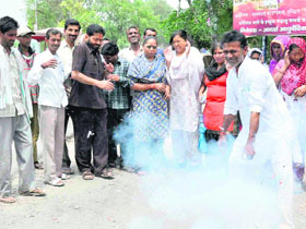On Chief Minister Vijay Bahuguna's announcement to hold Cabinet session in Gairsain, Congress workers welcome the decision by bursting crackers in Haridwar on Friday. 