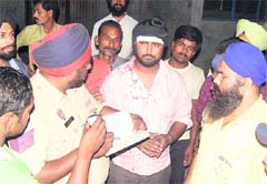A policeman records the statement of a pedestrian hit by the vehicle in Jalandhar on Thursday night.