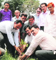 SP Sharma, Forest Range Officer, Reasi, along with others during a tree plantation drive at Narayan Shishu Kala High School in Reasi on Thursday.