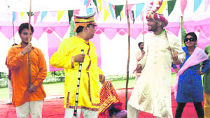 Artistes perform a play, Suno Tagore Di, at Tourist Bungalow in Ramban on Friday