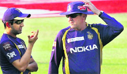 Kolkata Knight Riders' Gautam Gambhir (L) with coach Trevor Bayliss during a training session at Eden Gardens in Kolkata on Friday.