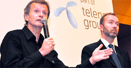Telenor Group CEO Jon Fredrik Baksaas (L) and Norwegian Trade & Industry Minister Trond Giske at a press conference on the telecom majors Indian operations in New Delhi on Saturday.