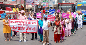 Members of the 7654 Sanjha Adhiyapak Front take out a protest march in Bathinda on Saturday.
