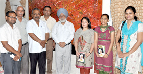 Principal of the DAV College, Bathinda, Dr JS Anand (fifth from left) along with meritorious students and the college staff.