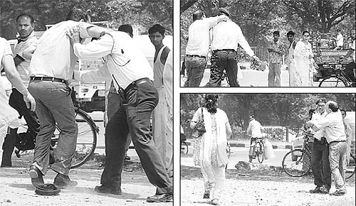 A traffic policeman being manhandled by a man over black film challan at the Sector-43 roundabout in Chandigarh on Saturday.