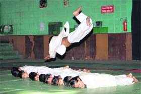 Children show skills during the Dehradun District Judo Championship in Dehradun on Saturday