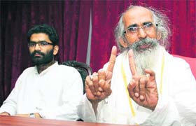 Swami Shivanand of Matri Sadan, Haridwar, addresses a press conference in Dehradun on Saturday
