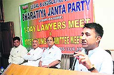 Rajesh Singh, national executive member of the BJP legal cell, addresses the gathering at the lawyers conference in Jammu on Saturday. 