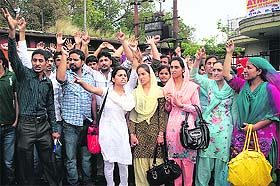 Members of the JK National Youth Corps Association stage a protest in Jammu on Saturday.