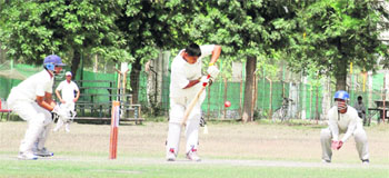 A batsman plays a shot during a cricket match between Ludhiana and Sangrur at the PAU in Ludhiana on Saturday. 
