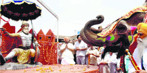 People celebrate 302nd anniversary of victory of Sirhind at Rakba village in Ludhiana on Saturday. 