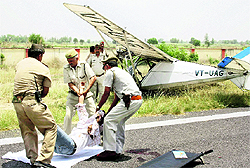 Policemen at the accident site near Meerut on Saturday