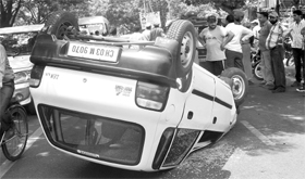 The car that overturned at Phase IX in Mohali on Sunday.