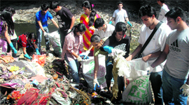 Members of Making A Difference, a youth organisation, pick up garbage on the bank of the Tamsa river near the Tapkeshwar temple, Dehradun, on Sunday.
