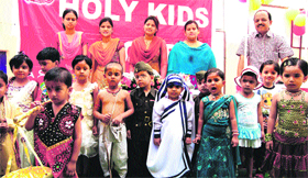 Tiny tots take part in a function organised on the occasion of Mothers Day at Holy Kids School in Haridwar on Sunday.