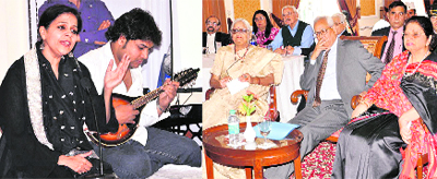 Rene Singh recites musical renderings of verses from the book Beautiful Country: Stories from Another India; (right) Governor NN Vohra and First Lady Usha Vohra at the book release function. 