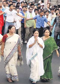 One year in office: With Rabindra Sangeet and other popular Bengali songs playing in the background, West Bengal Chief Minister Mamata Banerjee on Sunday led a huge, colourful procession covering various parts of Kolkata to celebrate the first anniversary of the victory of her Trinamool Congress in the Assembly polls