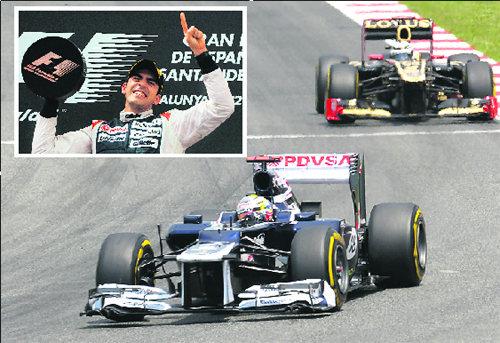 Williams Formula One driver Pastor Maldonado (inset) drives ahead of Lotus Kimi Raikkonen at the Spanish Grand Prix near Barcelona on Sunday