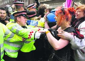 FOR A CAUSE: Demonstrators scuffle with the police during a protest by the Occupy movement in London