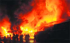 Firemen try to douse flames in the furniture market near Sectors 41 and 42, close to the Chandigarh-Mohali border, on Monday night.