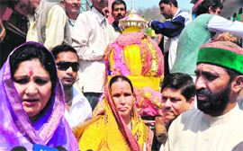 The palanquin of the deity of Shri Vishwanat Jagdishila that was brought at Brahamkund, Har-ki-Pauri, from the Bhilangana block of Tehri Garhwal in Haridwar on Monday. Cabinet Ministers Amrita Rawat and Mantri Prasad Naithani are also seen in the picture.