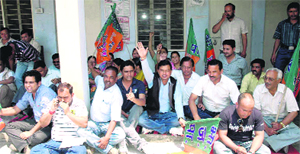 BJP workers stage a demonstration in protest against power crisis at Pithoragarh on Monday