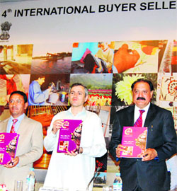 Chief Minister Omar Abdullah releases a brochure during the 4th international buyer-seller meet in Srinagar. 
