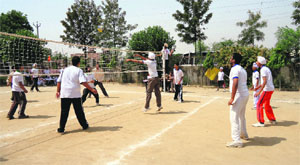 Students of Guru Gobind Singh Public School take part in a volleyball championship in Ludhiana. 