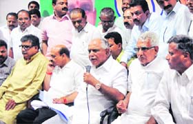 Former Karnataka CM BS Yeddyurappa addresses the media with his supporters in Bangalore on Monday