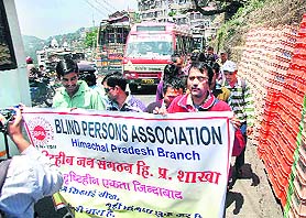 Members of the Himachal Blind Persons Association stage a protest march in support of their demands 