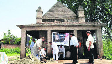 Kashmiri Pandit volunteers carry out renovation work at Vaitaal Bhairav Mandir in Srinagar on Tuesday.