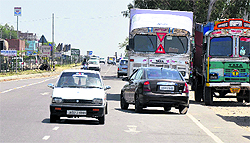 A car moves on the wrong side of the highway, as haphazard parking of trucks obstructs the movement of traffic, near Kunjwani Cantonment gate on the Bypass Road in Jammu