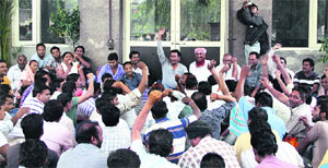 Members of the Safai Karamchari Union hold a protest outside the main gate of the Municipal Corporation office in Jalandhar on Tuesday.