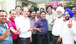 Varinder Sharma (centre blue shirt) with other members of the District Taxation Bar Association (sales tax) in Ludhiana on Tuesday