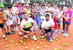 Tennis coaches Prince and Manjeet  with their students